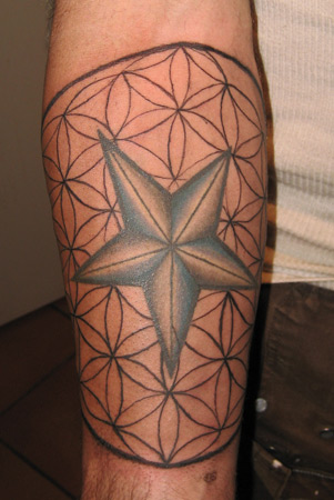  the Nautical Star tattooed in the foreground I added the Flower of Life 